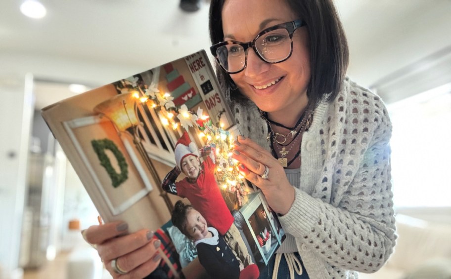 woman holding a diy light up photo canvas 