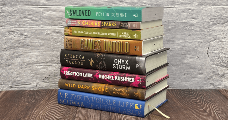 stack of books on a wood table