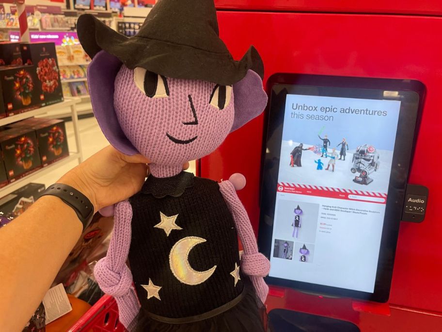 hand holding Hyde and EEK! Hanging Knit Character Witch