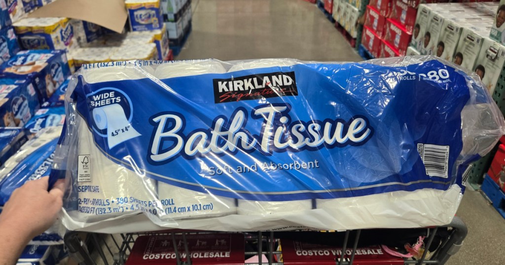 Large package of Kirkland bath tissue inside Costco shopping cart
