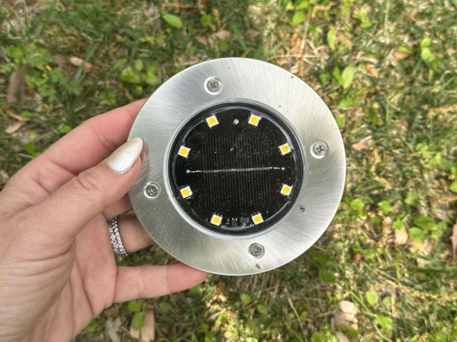 Hand holding a solar light