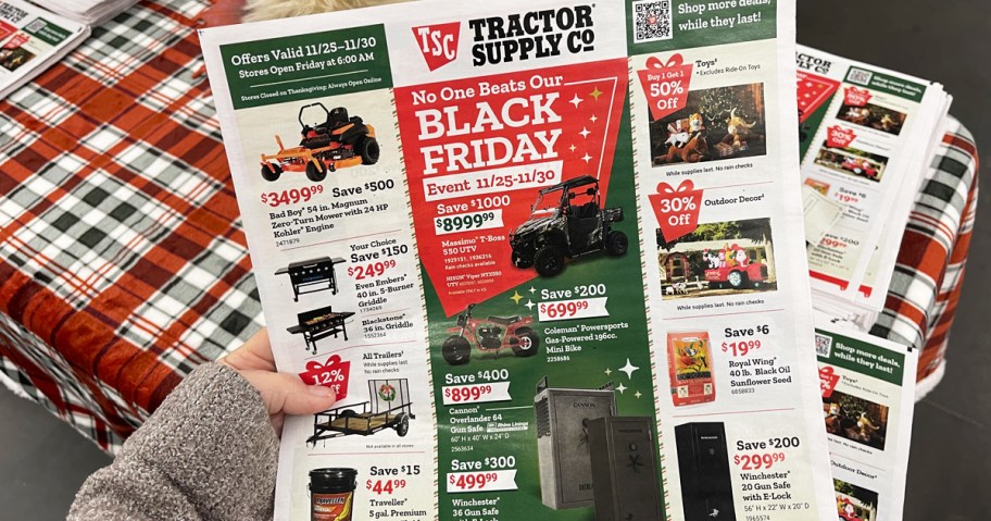 hand holding up Tractor Supply's Black Friday ad in store