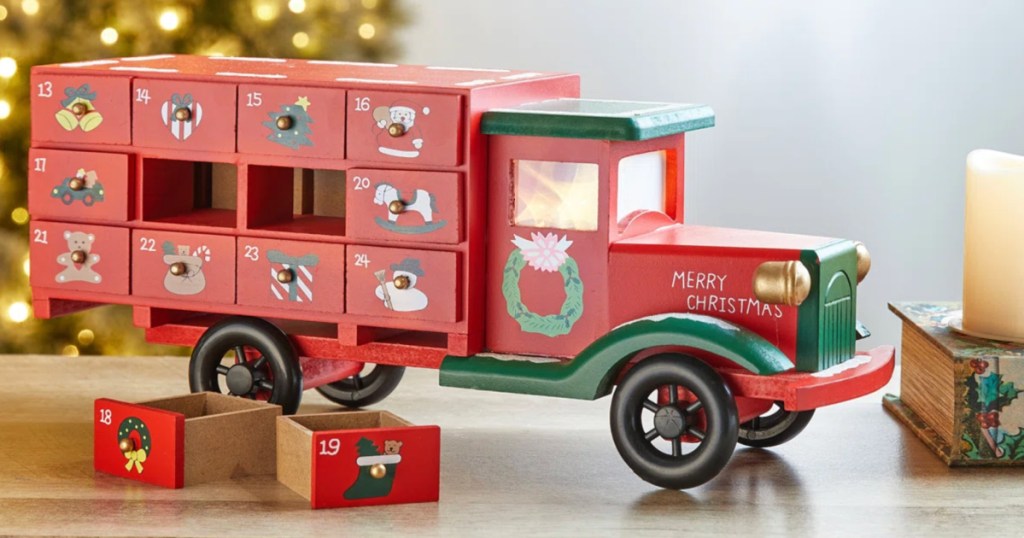 Red wooden Christmas truck with drawers for counting down the holiday