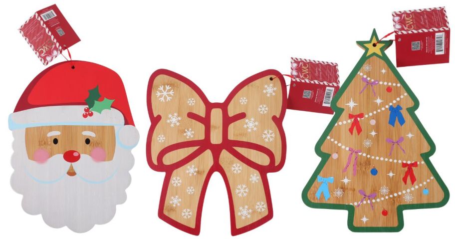 a santa, bow, and christmas tree cutting board