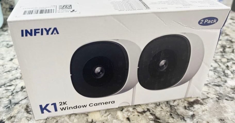 box of two cameras on counter
