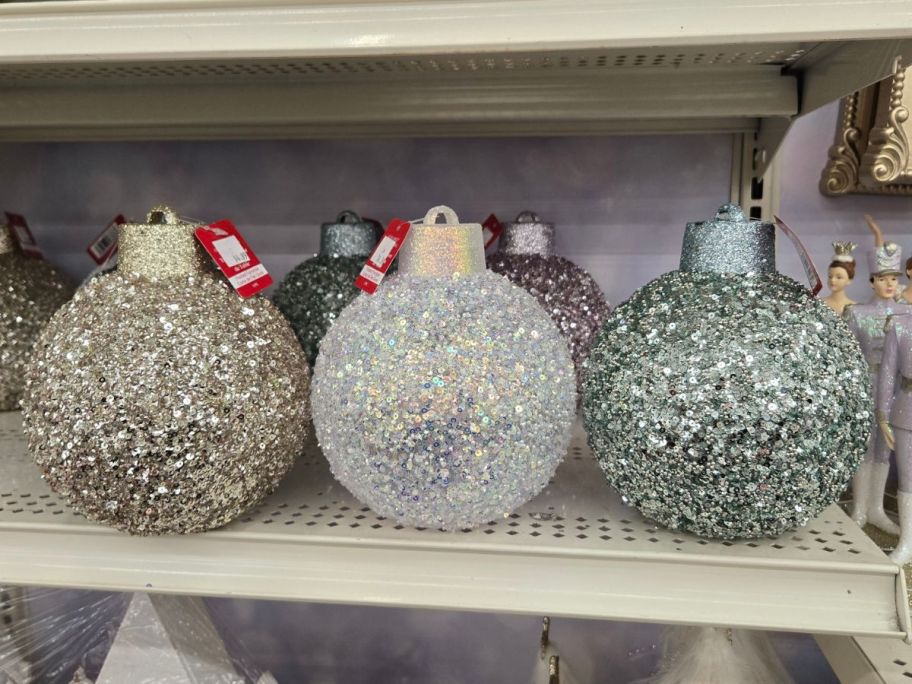 Glitter Ball Ornament Tabletop D&eacute;cor on shelf in store