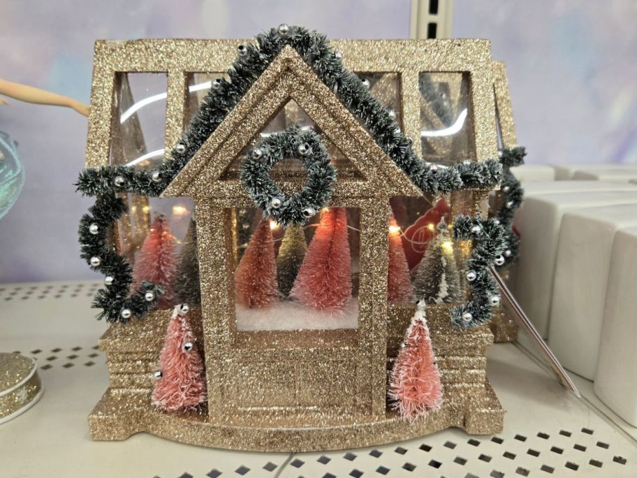 Gold Glitter House LED Tabletop D&eacute;cor on shelf in store