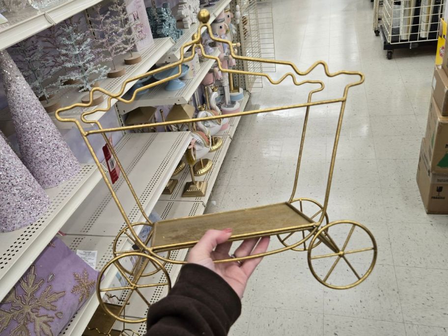 Gold Fairytale Carriage Wire Tabletop D&eacute;cor in hand in store