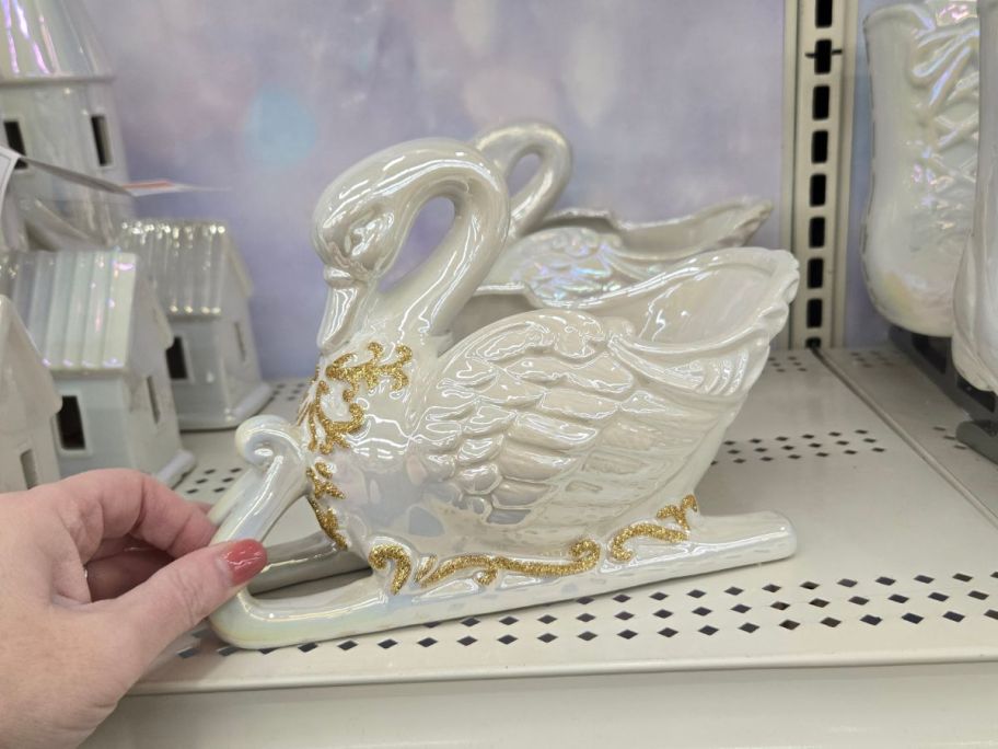 Ceramic Swan Sled Tabletop D&eacute;cor on shelf in store