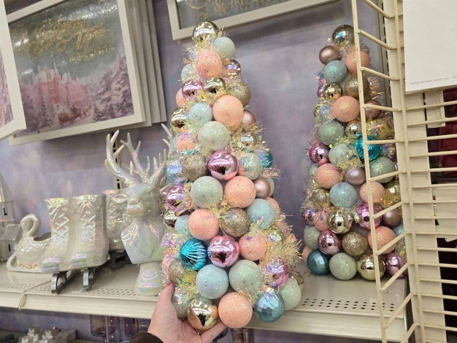 Sparkly Sugar Plum Tabletop Ornament Tree in hand in store