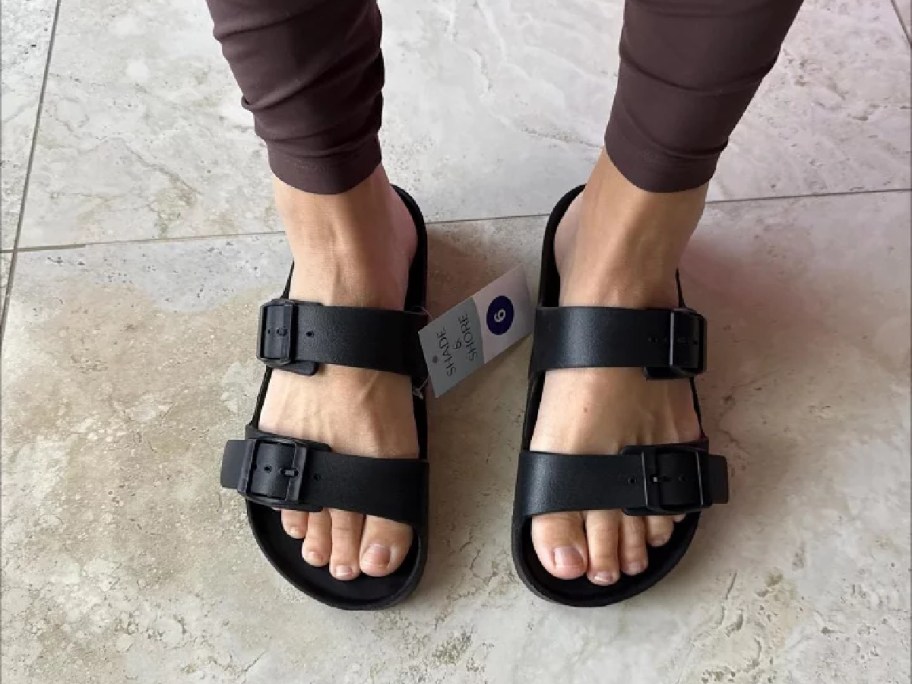 A woman wearing black sandals from Target.