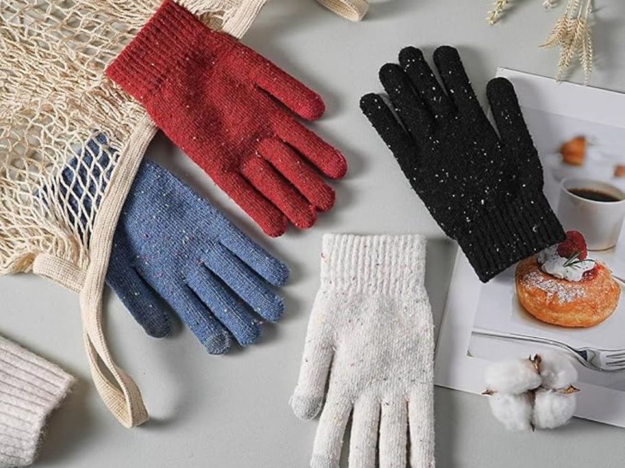 four winter gloves on display