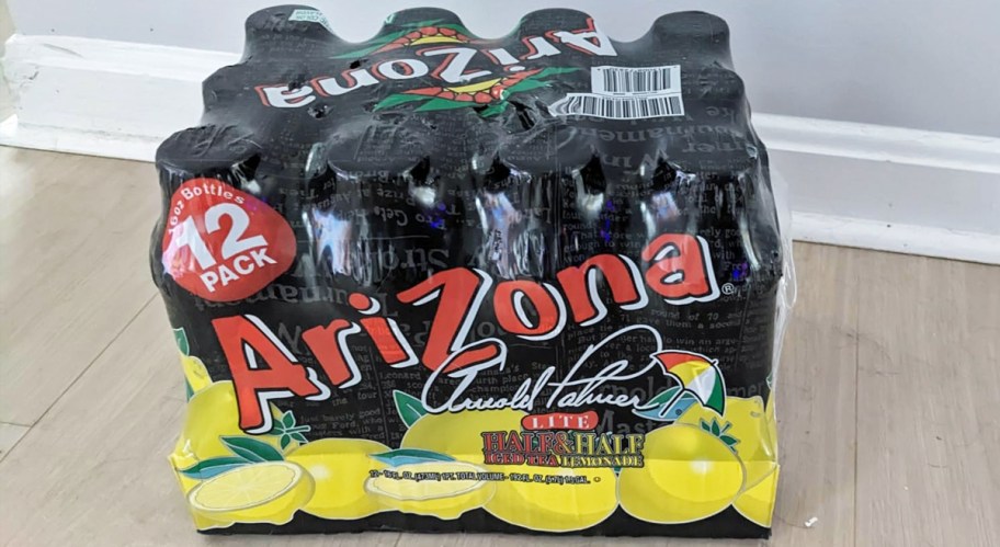 case of Arizona Arnold Palmer bottles on floor
