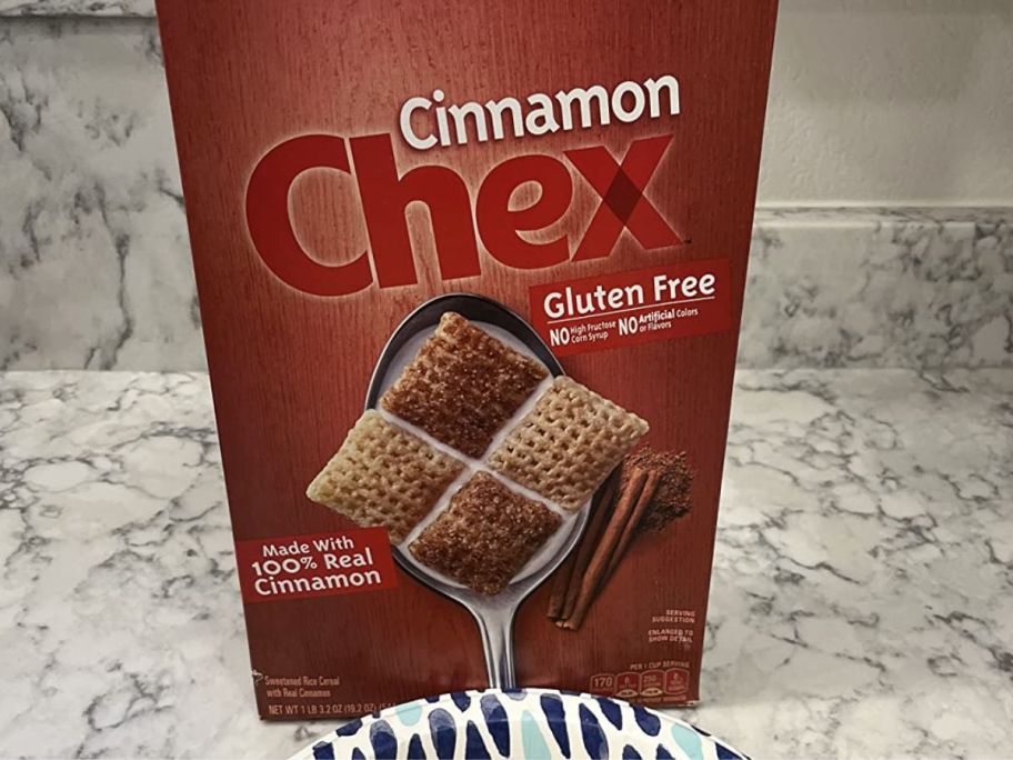 A Cinnamon Chex cereal box on a counter