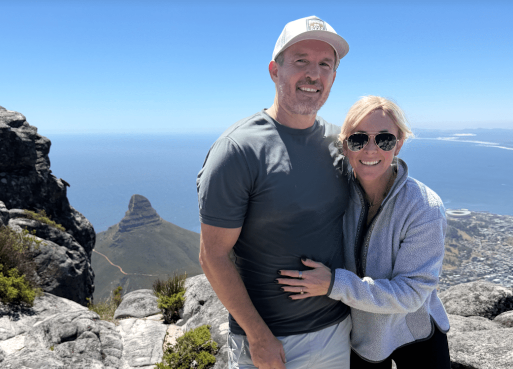 Collin with husband on mountain in Africa 