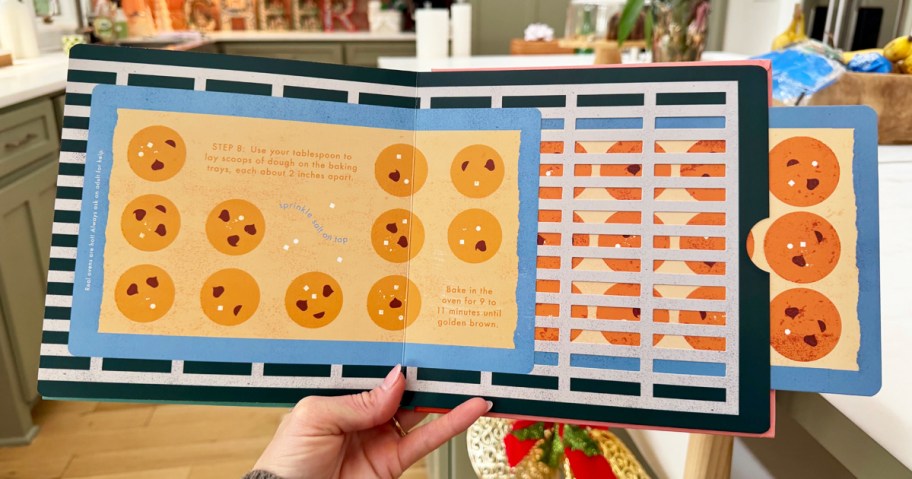 hand holding an interactive kids cookies cookbook