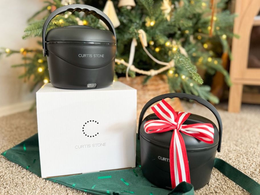 Two Curtis Stone Portable Food warmers in front of a Christmas Tree