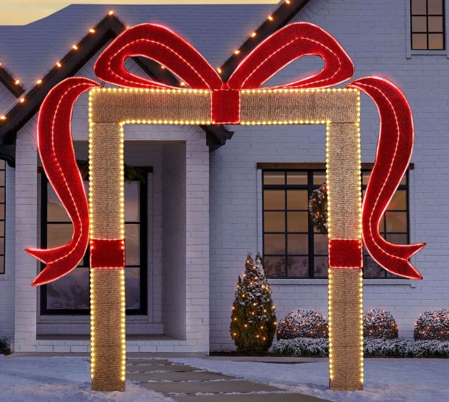 a lighted wrapped gift bow arch
