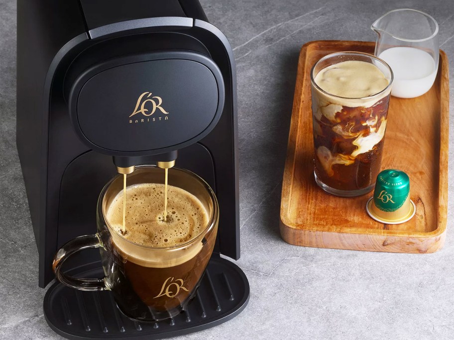 black espresso machine brewing coffee
