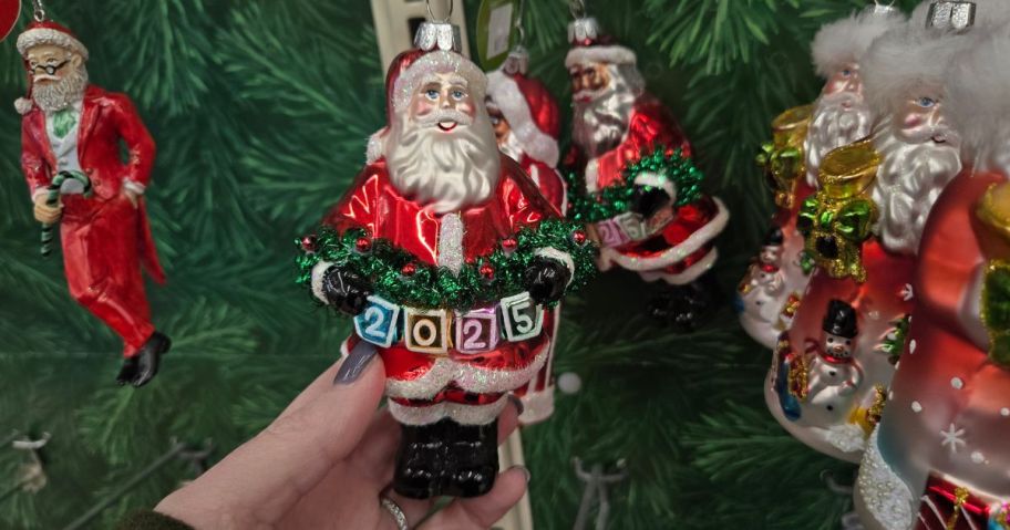 A glass Santa ornament in a store