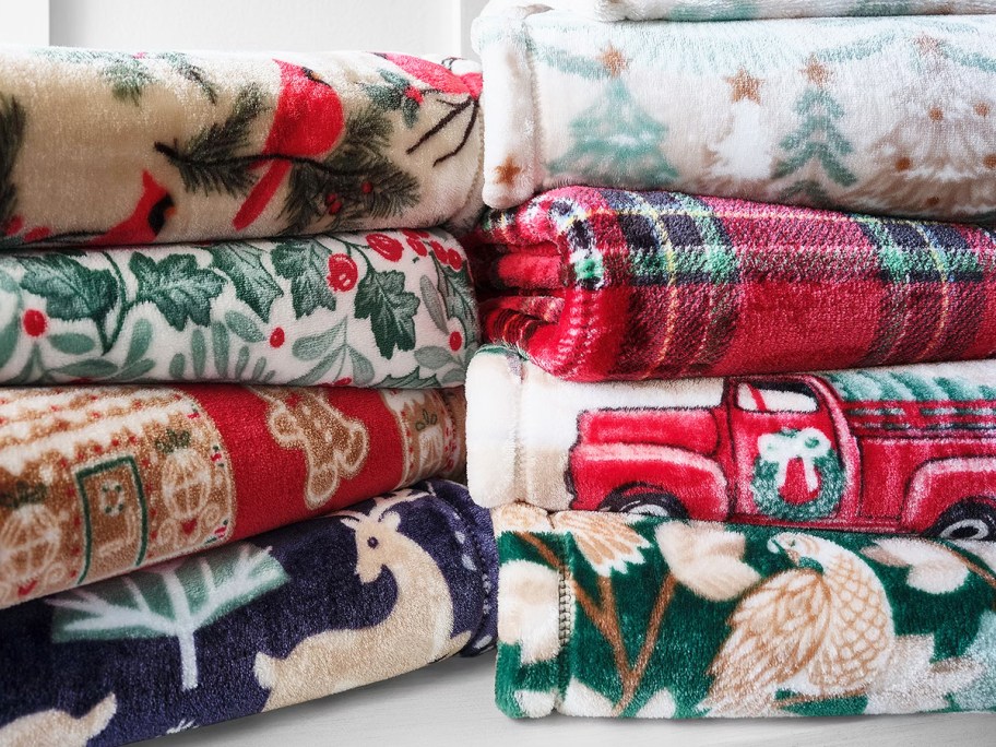 stacks of folded christmas throws
