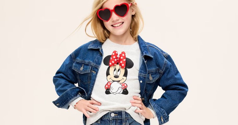 Girl wearing red heart sunglasses and a Disney Old Navy Minnie Mouse 