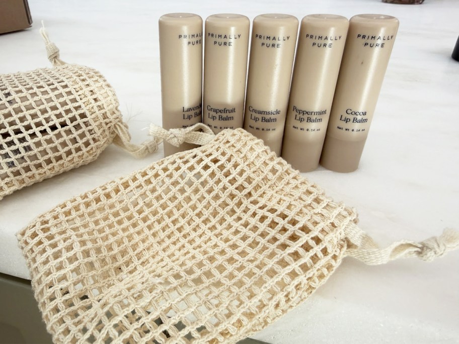 5 tubes of lip balm with a gift bag