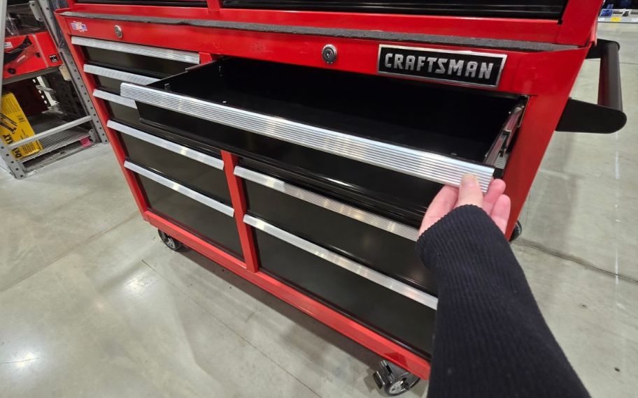 hand holding Red Tool Chest