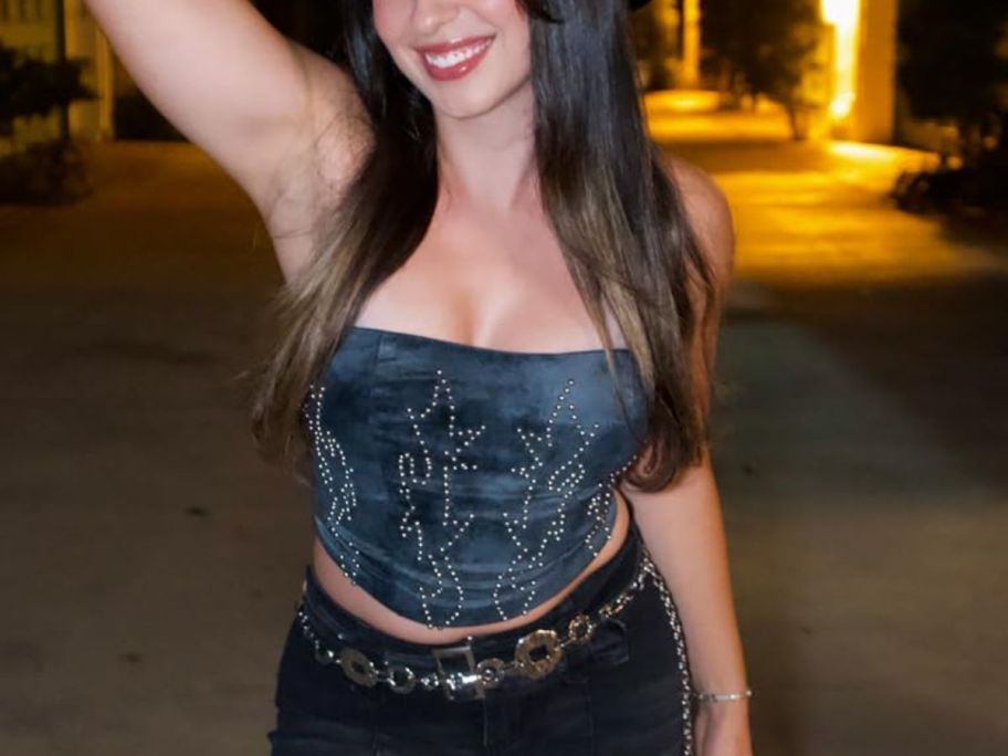 woman wearing a sticy bra with a corset top