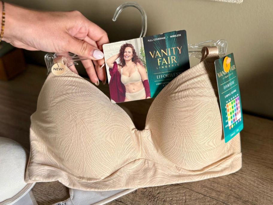 Hand holding a vanity Fair simple sizing bra