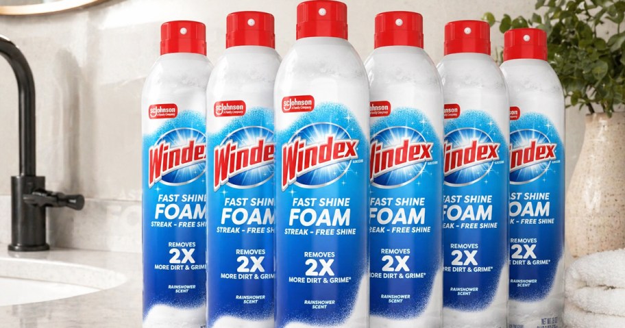 multiple bottles of Windex Fast Shine Foam Glass Cleaner on a bathroom counter