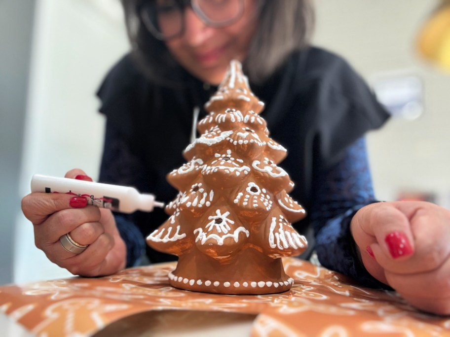 adding puffy paint to paintable christmas tree 