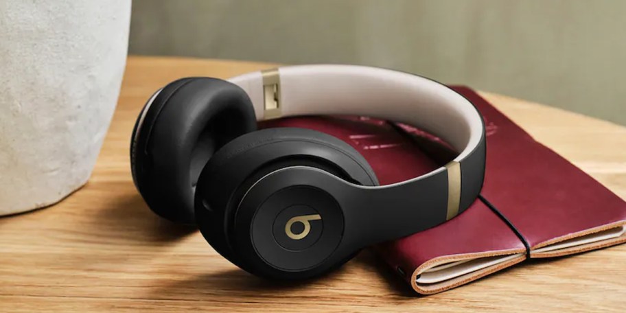 black headphones laying on table 