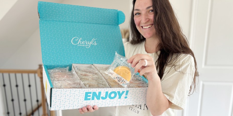 woman holding box of cheryls cookies