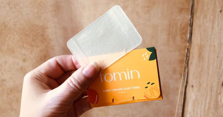 hand holding fomin hand soap sheet and box