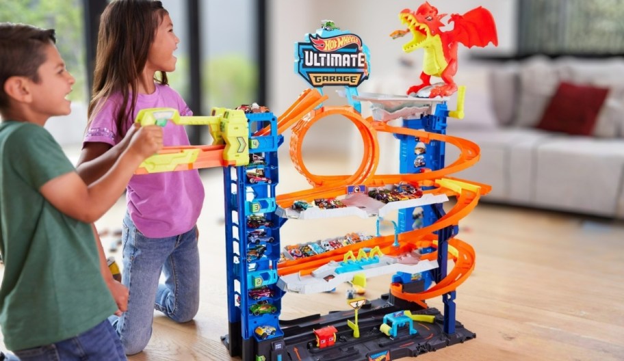 kids playing with a hot wheels ultimate garage