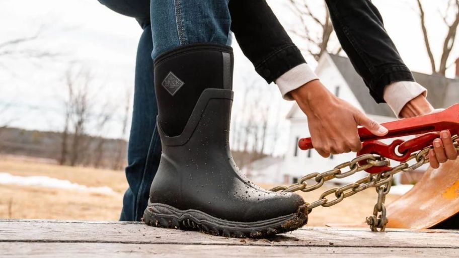 womans foot in a pull on rubber Muck boot