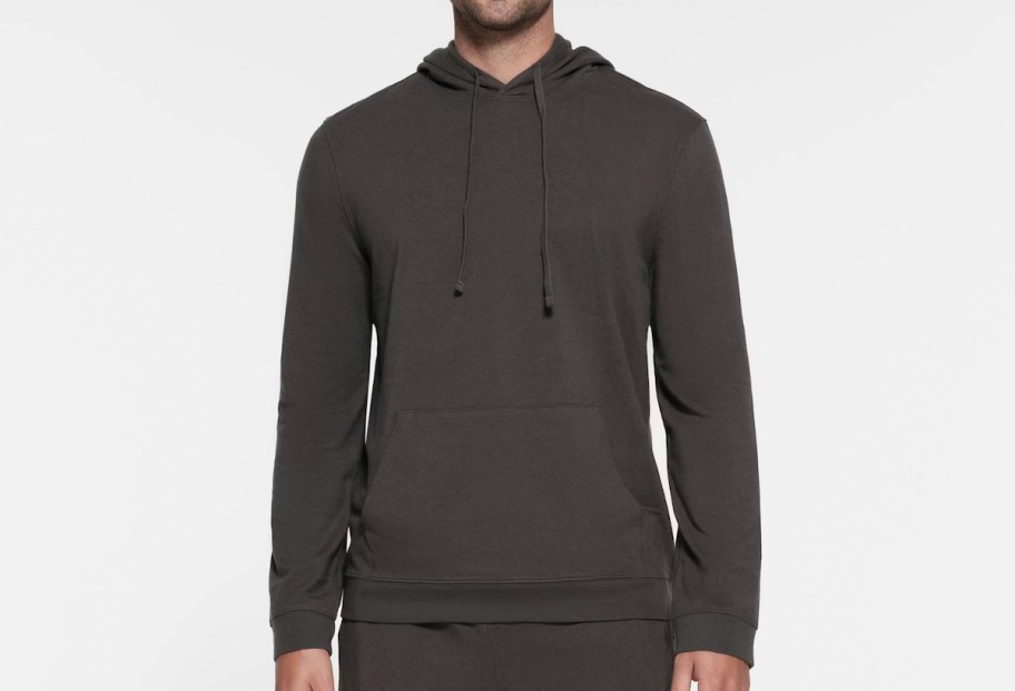 man wearing gray hoodie stock photo