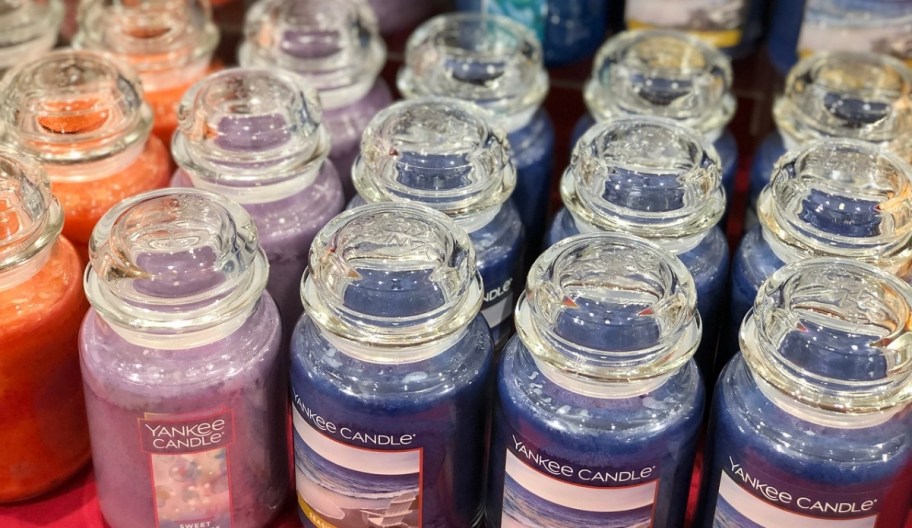 rows of yankee jar candles on a store shelf