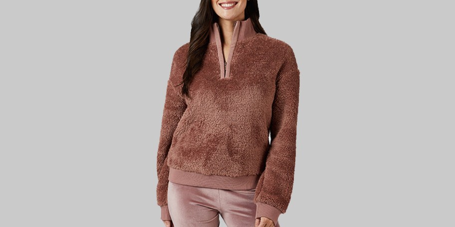 woman wearing pink sherpa jacket 