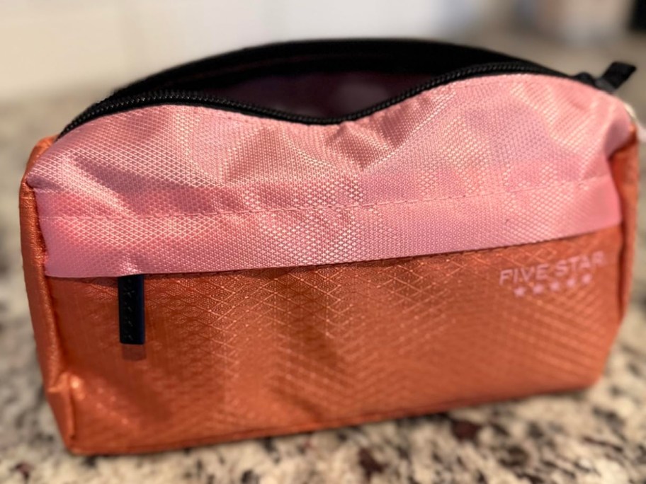 An open Five Star pink pencil case.