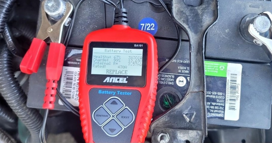 an ANCEL Car Battery Tester on a car battery