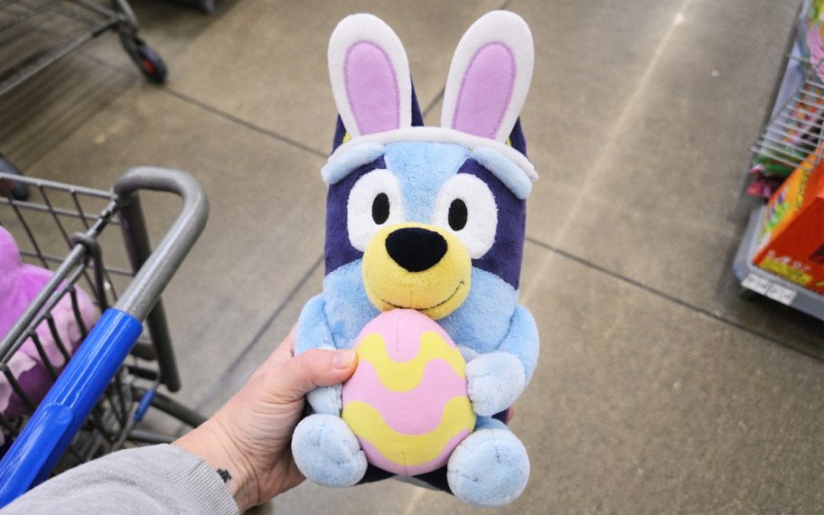 hand holding up a Bluey Easter Plush in store