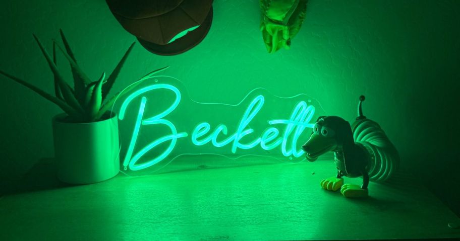 A green custom Neon sign that says becket