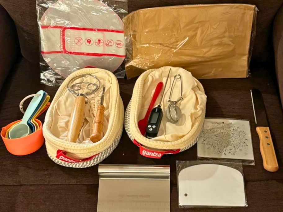 complete sourdough bread starter kit with baskets and utensils sitting on table