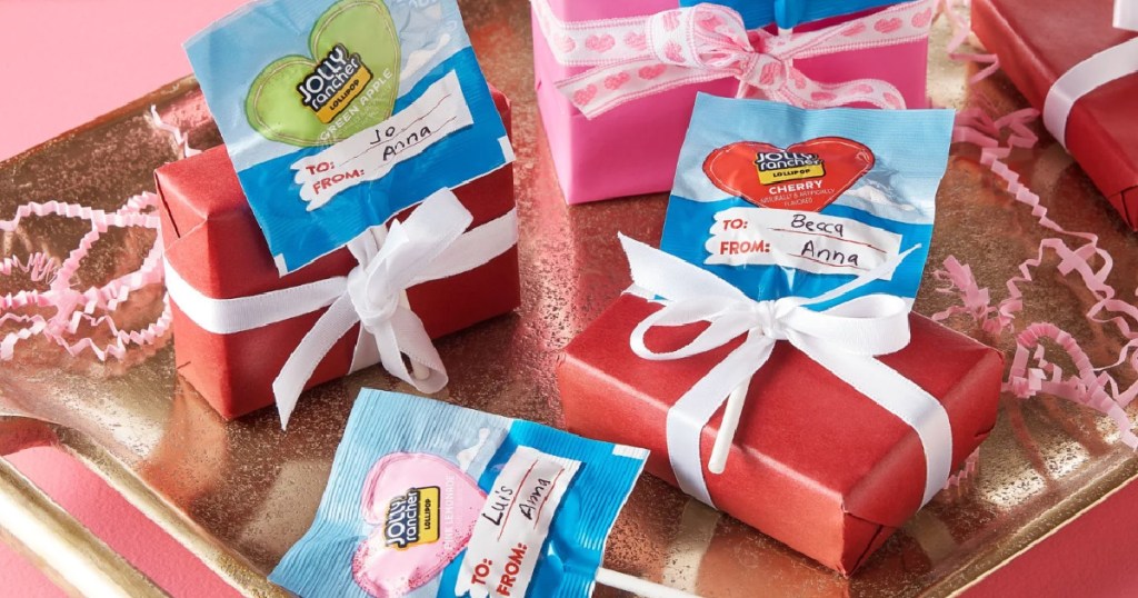 Jolly rancher valentine lollipops attach to wrapped gifts