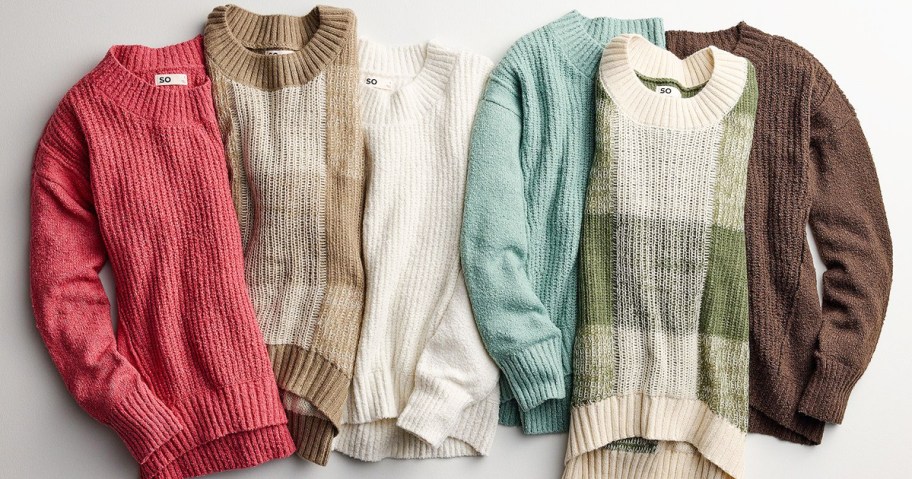multiple women's sweaters in a row