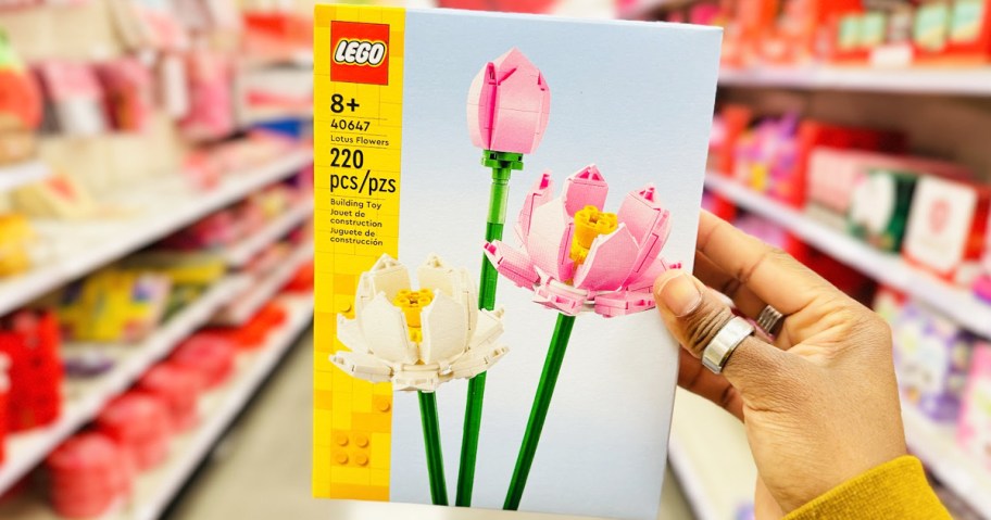hand holding lego lotus flowers set 