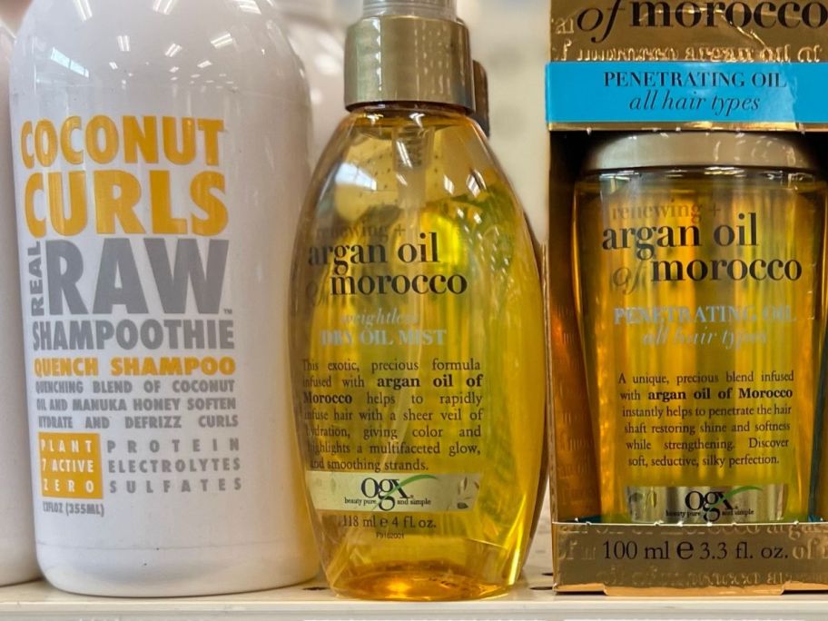 OGX Renewing + Argan Oil Treatment Spray 4oz on shelf in store