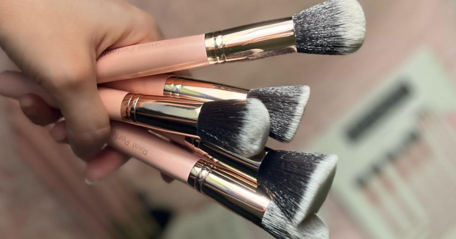 hand holding Real Perfection Makeup Brush Set